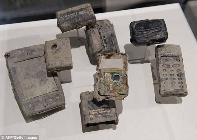 Memorials: Mobile phones and other communication devices found in the rubble from the September 11 attacks in 2011 on the World Trade Center are displayed as part of a new exhibit in Washington D.C.