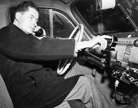 An engineer demonstrates a car phone five months before the historic first call on a competing company’s commercial mobile telephone service in 1946.