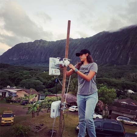Spectrum sovereignty advocate Darrah Blackwater works to install broadband equipment for Native communities during the pandemic.